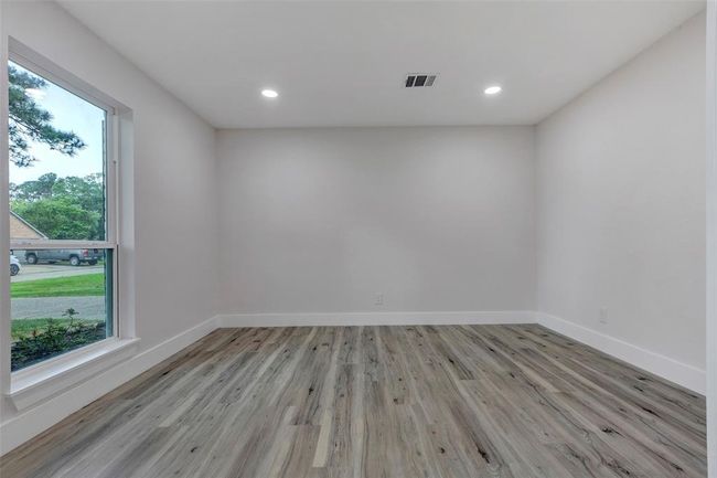 Formal dining room with recessed lights and new Vinyl flooring. | Image 21