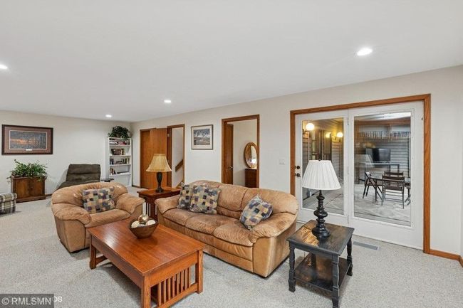 Lower level rec room has a patio door that leads to an amazing 3 season porch! | Image 38