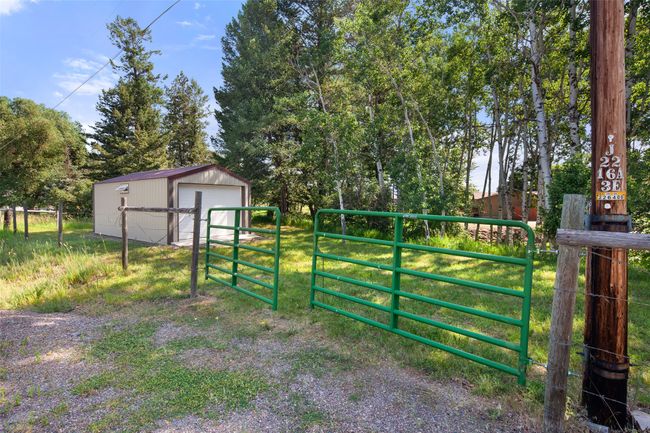 View of yard with a detached garage with gated entry | Image 59