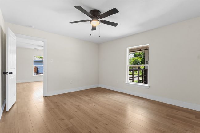 Unfurnished room featuring ceiling fan and light wood-style floors | Image 10