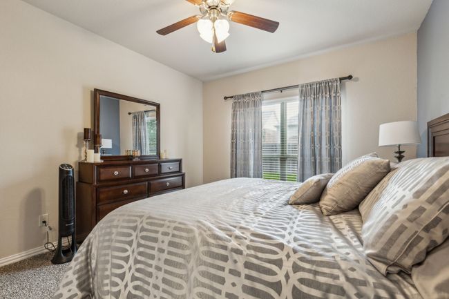 Carpeted bedroom featuring baseboards and a ceiling fan | Image 14