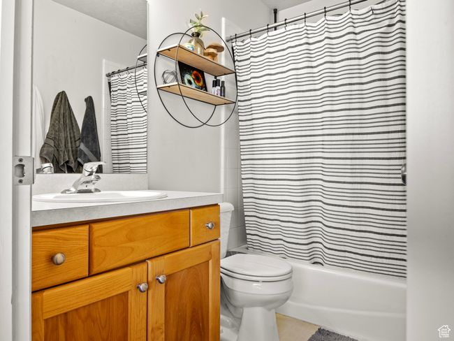 Bathroom featuring tile patterned flooring, vanity, and toilet | Image 20