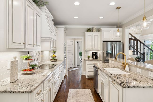 This kitchen offers a blend of beauty, function, and design! Updated lighting, faucet, and hardware in 2022. New Refrigerator 2020. | Image 14