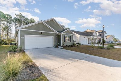 View of front of home featuring a garage | Image 2