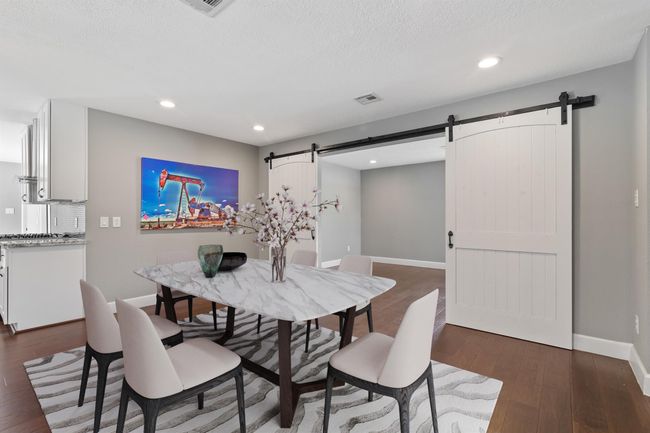 Virtually staged photo of the dining room. | Image 6