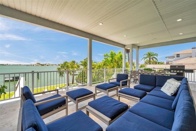 Huge covered 2nd story balcony with travertine tile. | Image 19