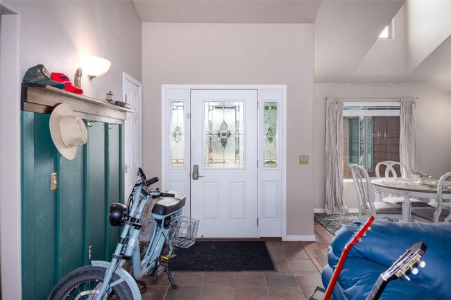Entrance foyer featuring tile patterned floors, baseboards, and plenty of natural light | Image 34