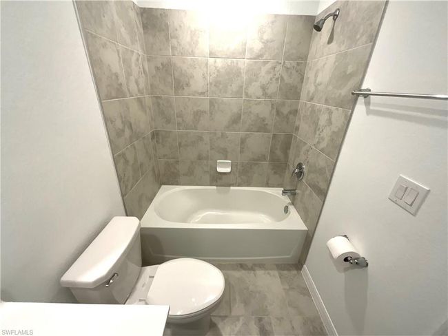 Full bathroom featuring toilet and tub / shower combination | Image 22