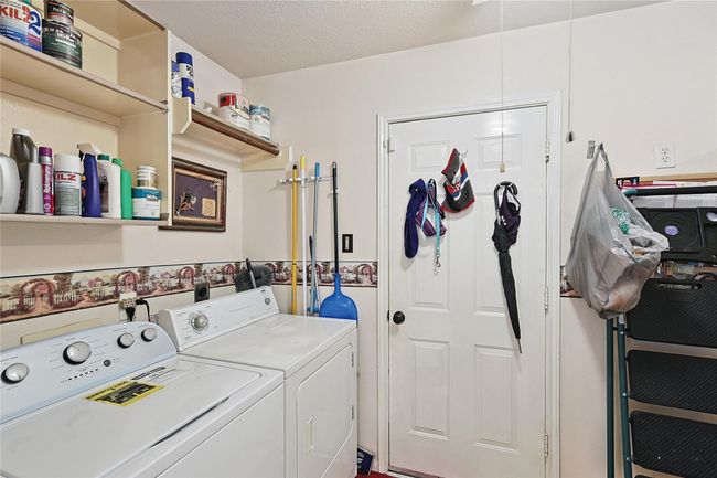 Spacious, well-kept laundry room with like-new washer and dryer included — offering convenience, storage space, and move-in ready ease. | Image 10