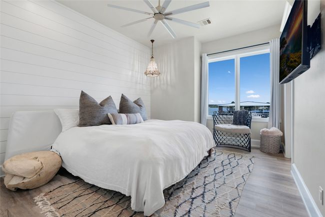 Bedroom with light wood finished floors, recessed lighting, and a ceiling fan | Image 21