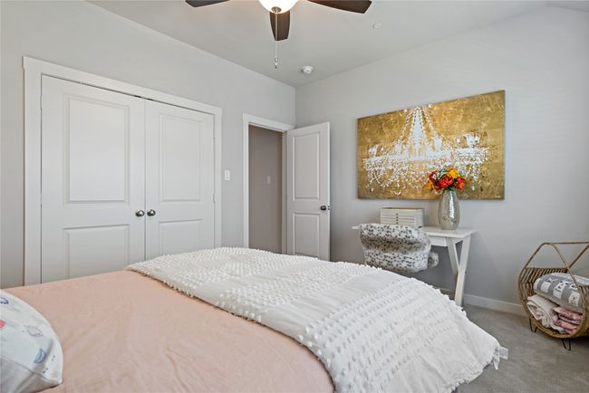 Bedroom with carpet flooring, ceiling fan, and a closet | Image 18