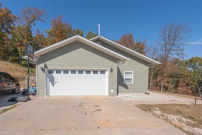 View of home's exterior with a garage | Image 1