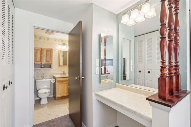 Cute extra vanity area in the primary bed area | Image 21