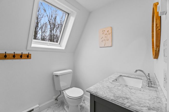 Skylight in upstairs bathroom provides extra light | Image 25