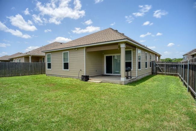 Back of house with a patio, a fenced backyard, and a shingled roof | Image 30