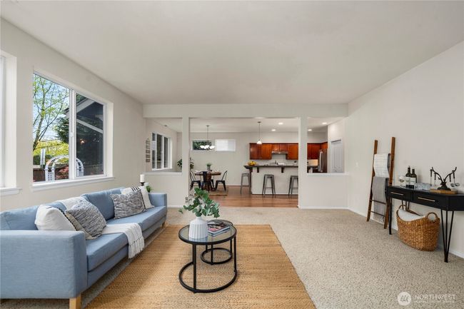The living room is massive and is open to the large kitchen + dining room | Image 8
