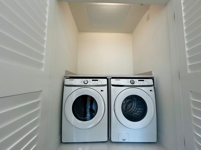 Clothes washing area with separate washer and dryer and laundry area | Image 21
