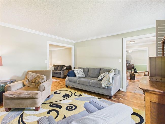 Nice den to relax and enjoy the fireplace. | Image 7