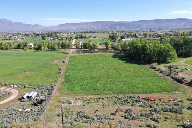 Aerial overview of property's location featuring mountains and rural landscape | Image 30