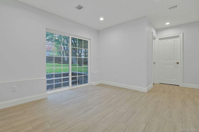 Family room featuring tiled floors and recessed lighting | Image 22