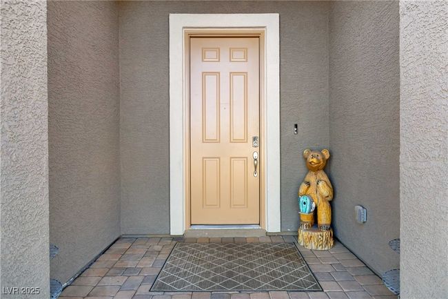 View of exterior entry with stucco siding | Image 10