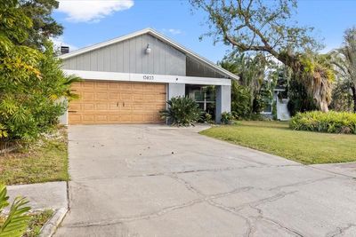 13833 Cherry Creek Drive, House other with 3 bedrooms, 2 bathrooms and null parking in Tampa FL | Image 2