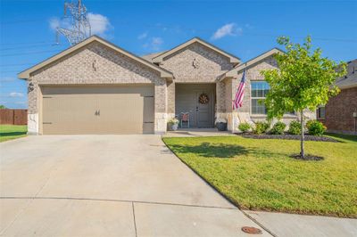 View of front of property with a front yard and a garage. | Image 1