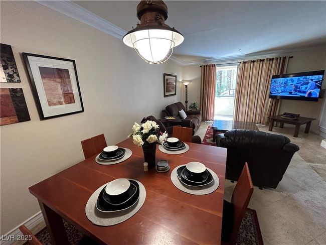 Dining space featuring crown molding and baseboards | Image 28
