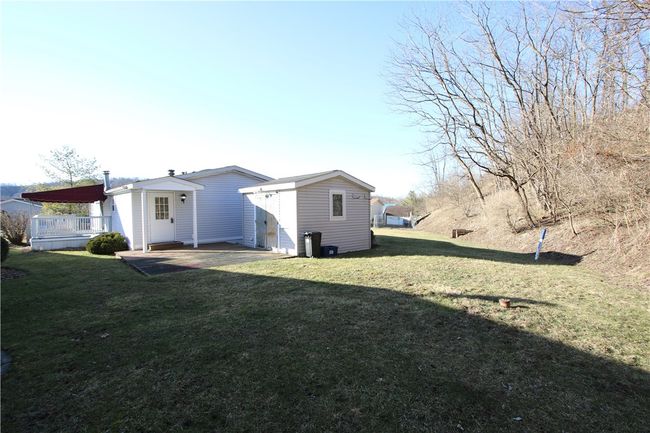 Nice Level Back Yard bordering Woods. Shed Included. | Image 27