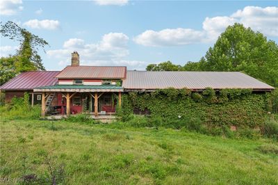 A back view of this truly exceptional property, clearly showing the two additions either side of this original period home | Image 3