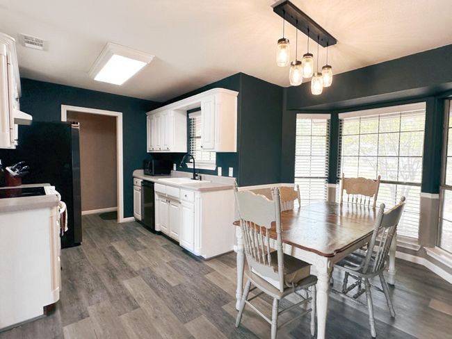 Dining area surrounded with windows with views | Image 8