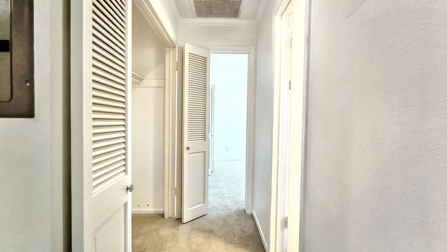 Hall with light colored carpet | Image 21
