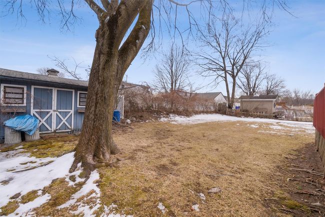 Snowy yard featuring a shed | Image 40