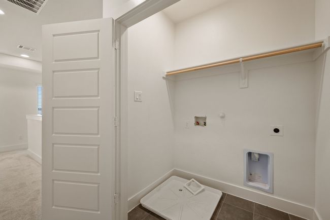 Laundry area featuring hookup for a washing machine, electric dryer hookup, laundry area, gas dryer hookup, and visible vents | Image 31