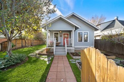 WELCOME HOME to 1701 Shearn! This charming Craftsman bungalow sits on a CORNER lot, in the High First Ward Historic District! | Image 1