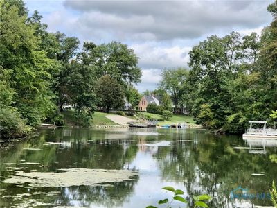 As you enter the community you pass this tranquil private pond on your way to the lot. There is no recreational access to this pond. | Image 3