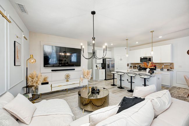 living area featuring visible vents, light wood finished floors, and recessed lighting | Image 7