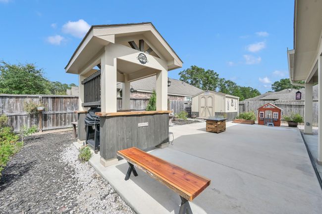 The stylish covered BBQ pavilion and extended patio create the ultimate back-yard entertainment space. | Image 34