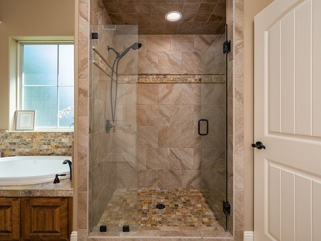 Bathroom with a bath and a stall shower | Image 20