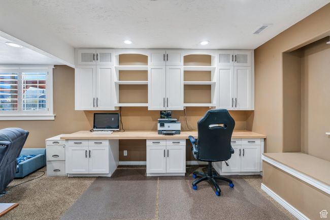 Office space with built in desk and recessed lighting | Image 18