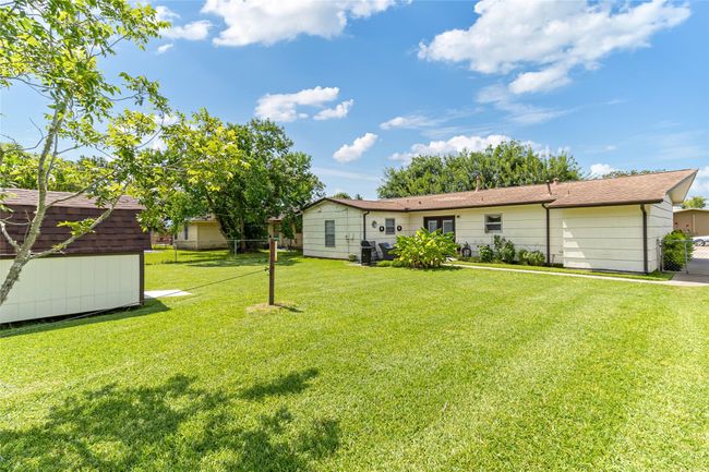 A convenient sidewalk runs from the front driveway all the way to the back door, making backyard access simple and practical. | Image 21