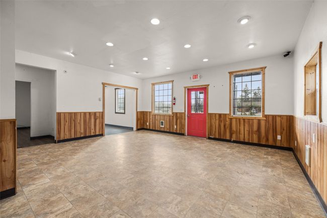 Empty room with wainscoting, wooden walls, and recessed lighting | Image 57
