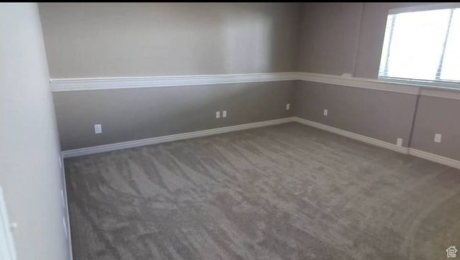 Carpeted spare room with baseboards | Image 52