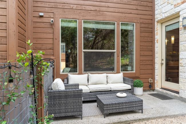 View of patio featuring outdoor lounge area | Image 32