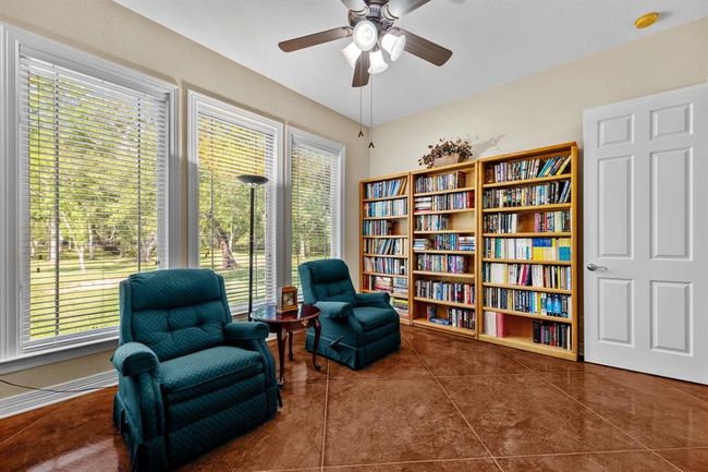 This room boasts serene views of the yard. | Image 29