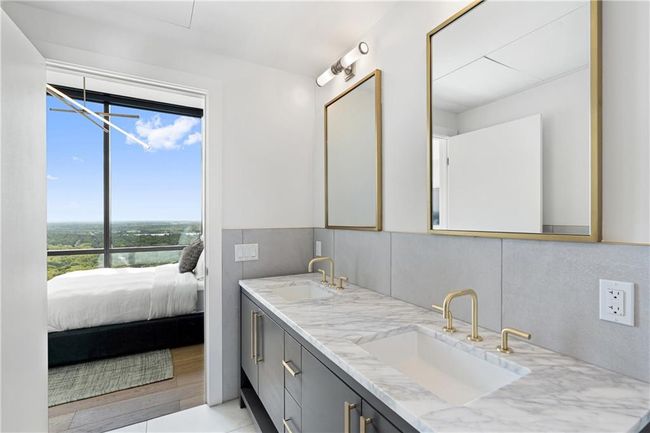 Full bathroom with double vanity, ensuite bathroom, and a sink | Image 16