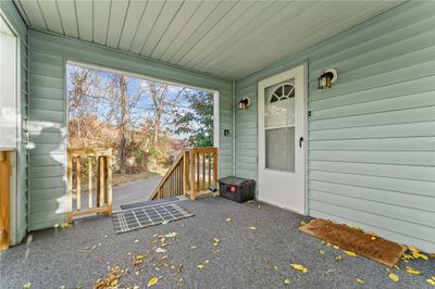 Cozy, covered side porch | Image 3