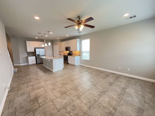 Living room and Dining area open floor plan, ceiling fan, and recessed lighting | Image 10