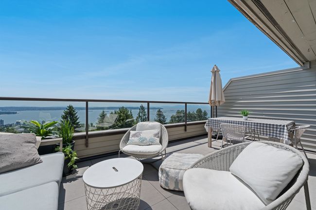 Patio / terrace with a water view | Image 13