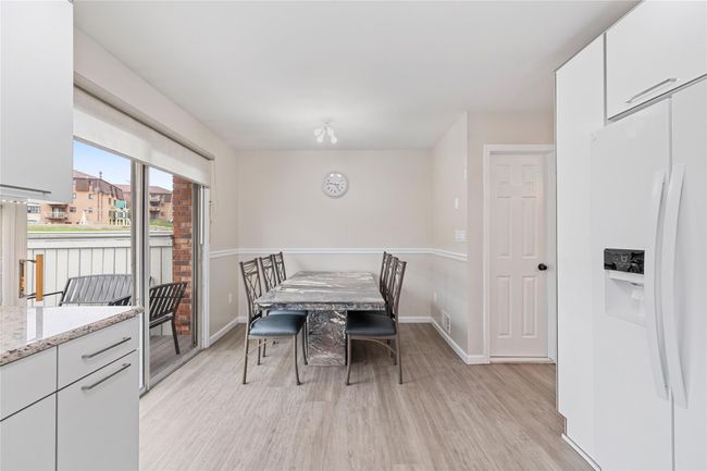 Dining room with baseboards, visible vents, and light wood finished floors | Image 16